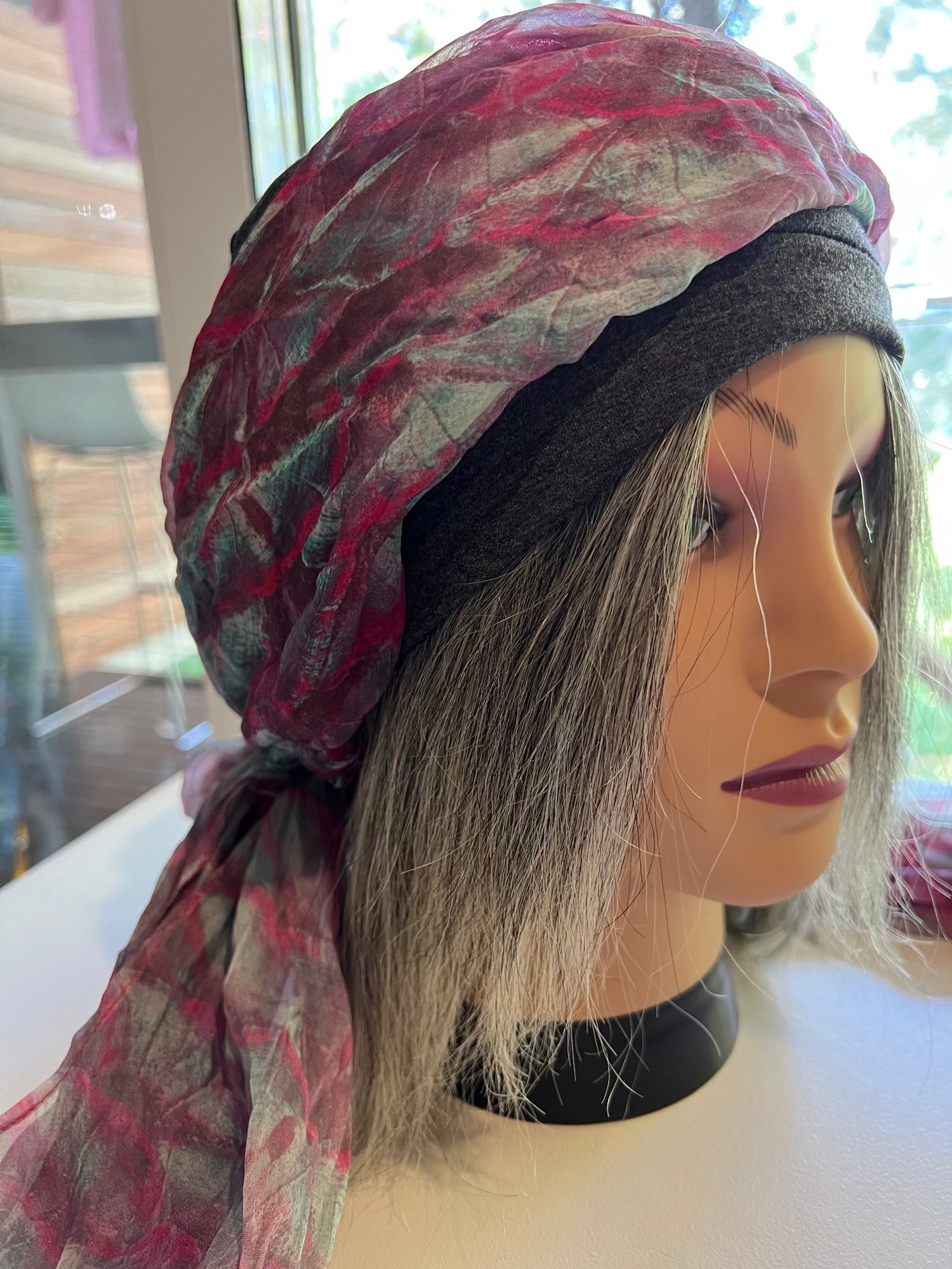 Mannequin with halo wig in grey human hair with pink scarf and grey softie