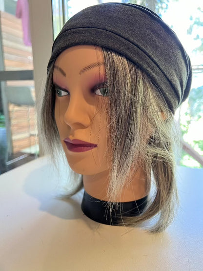 Mannequin with halo wig in grey human hair from two Hair for Hats long pieces - worn under pink scarf and grey softie