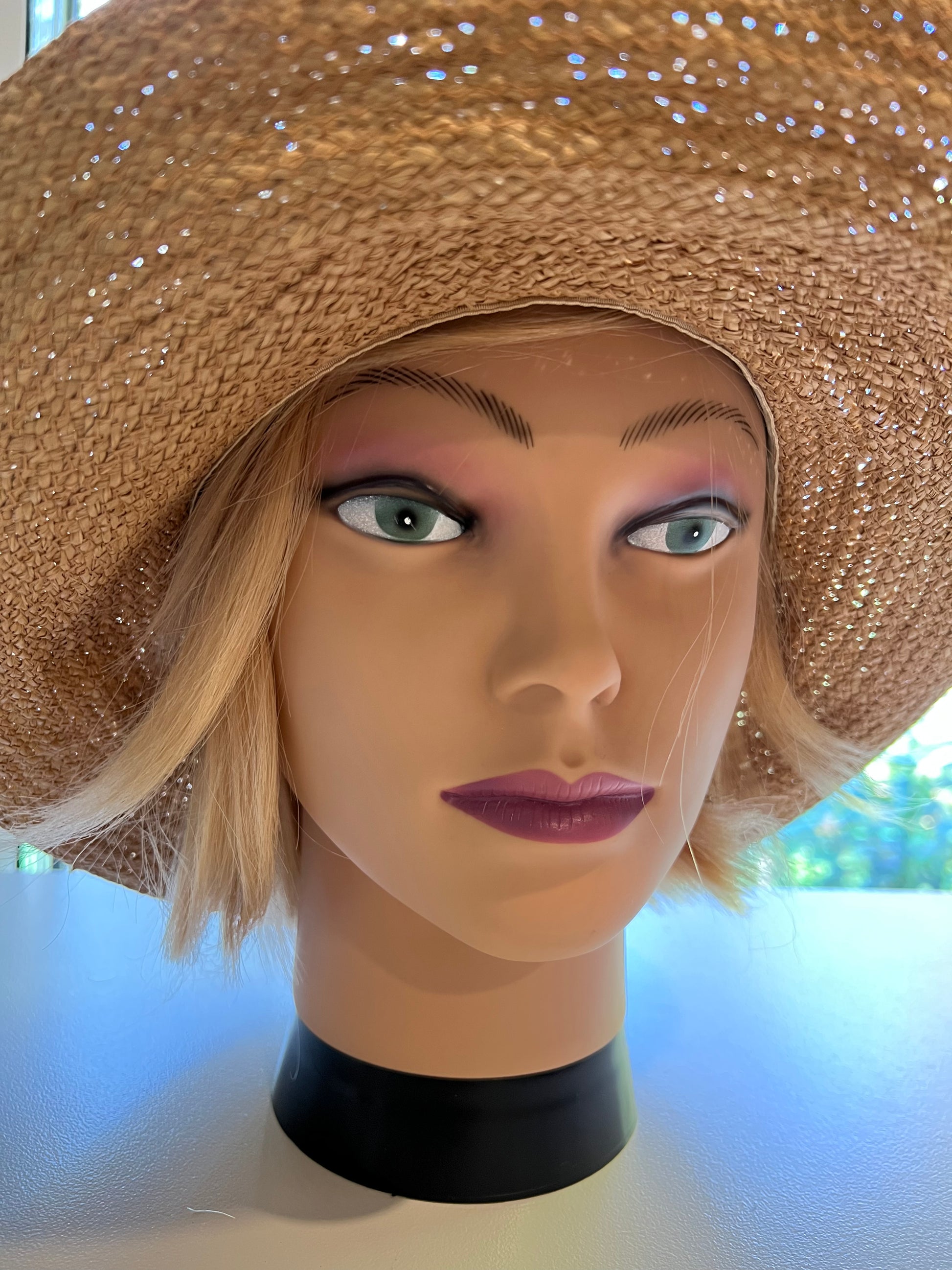 Mannequin with hat with hair in strawberryblonde halo wig human hair front view