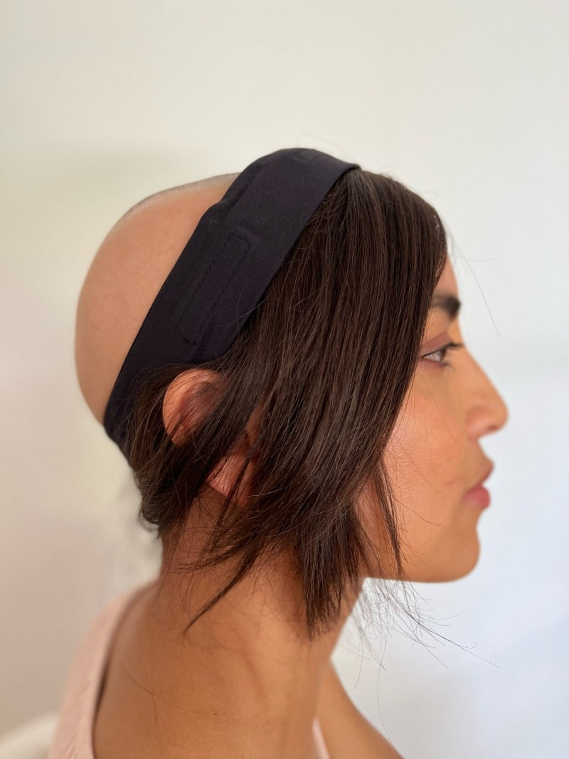 Woman who is bald wearing dark brown headband human hair hat wig